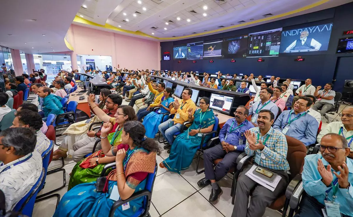 Scientists of ISRO celebrate the success of Chandrayaan-3 at the ISTRAC command network, in Bengaluru on August 26.