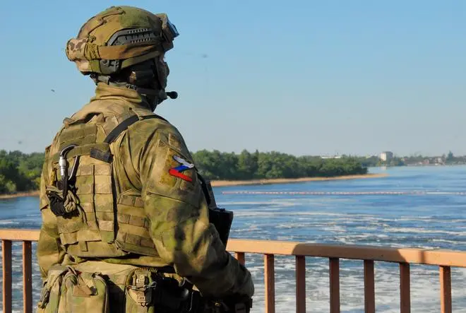 Russian troops guard the strategic Kakhovka Hydroelectric Power Plant on the Dniepr river in Kherson region, Ukraine. The water from the dam has for decades been used for irrigation purposes both in Ukraine and Crimea, but in 2014 the Ukrainian authorities blocked the flow of the water to Crimea. Russian troops guard the strategic Kakhovka Hydroelectric Power Plant on the Dniepr river in Kherson region, Ukraine. The water from the dam has for decades been used for irrigation purposes both in Ukraine and Crimea, but in 2014 the Ukrainian authorities blocked the flow of the water to Crimea.