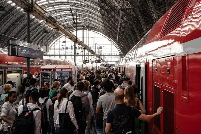 Germany carried out a drastic experiment in the three months of summer (June, July, and August) of issuing monthly public transport tickets priced at €9. This meant that people could travel across the country for a fraction of the price they would normally pay. Here, passengers wait to board a train on a platform at Frankfurt Central Station on August 31, the last day of the scheme. Germany carried out a drastic experiment in the three months of summer (June, July, and August) of issuing monthly public transport tickets priced at €9. This meant that people could travel across the country for a fraction of the price they would normally pay. Here, passengers wait to board a train on a platform at Frankfurt Central Station on August 31, the last day of the scheme.