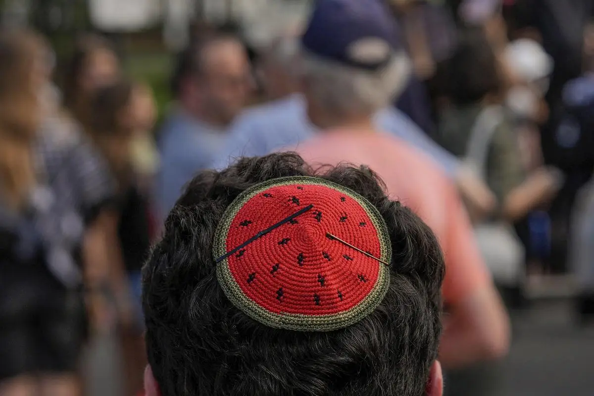 A Jewish demonstrator wears a watermelon kippah while protesting Israeli Prime Minister Benjamin Netanyahu’s visit to Washington, Monday, July 7, 2025, near the White House.