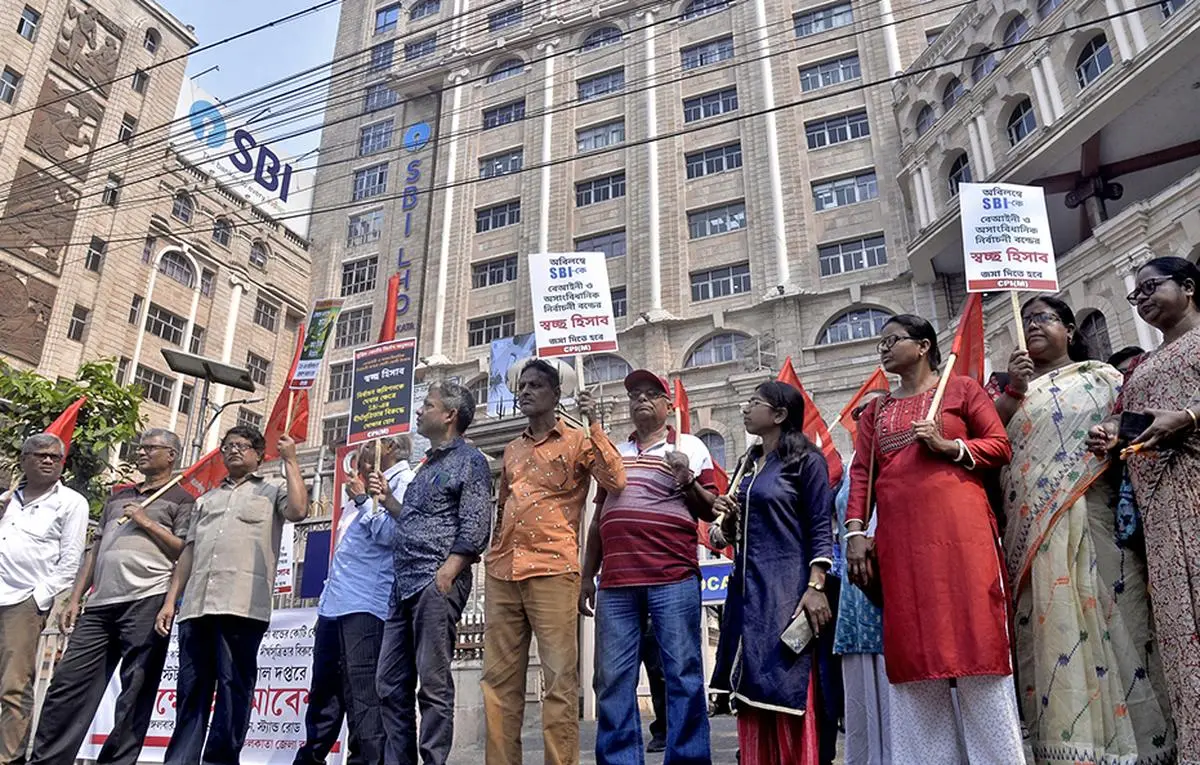 CPI(M) supporters protest outside the SBI regional office in Kolkata over the electoral bonds issue on March 12, 2024.