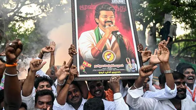 TVK supporters celebrate after the party gained support from other parties to form the government, in Chennai on May 8.