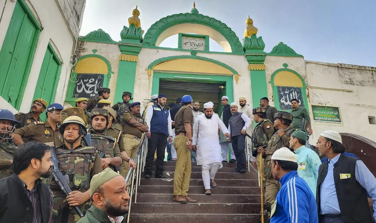 Devotees leave after offering prayers at the Shahi Jama Masjid amidst tight security in Sambhal on November 29.