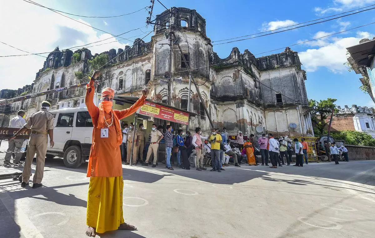 A sadhu celebrates in Ayodhya as the area for the Ram temple is marked out in August 2020. The Sangh Parivar has filled India’s ideological vacuum with the hectoring promise of a Hindu Rashtra. 