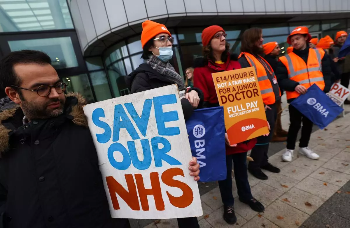 Junior doctors strike on a picket line outside the Queen Elizabeth Hospital in Birmingham, UK, on December 20, 2023. 