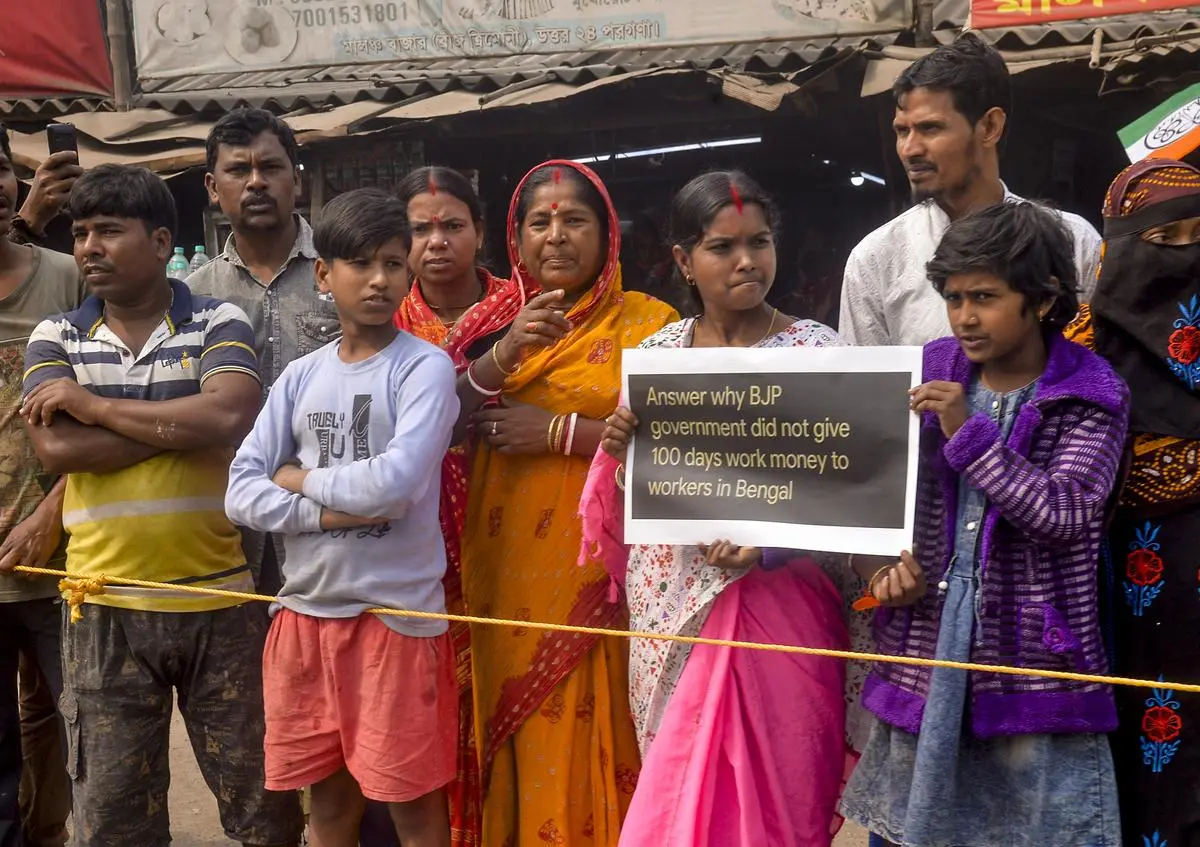 TMC supporters line the route as West Bengal Governor C.V. Ananda Bose’s convoy passes in North 24 Parganas on February 12 in protest against the Centre not releasing funds to the State.