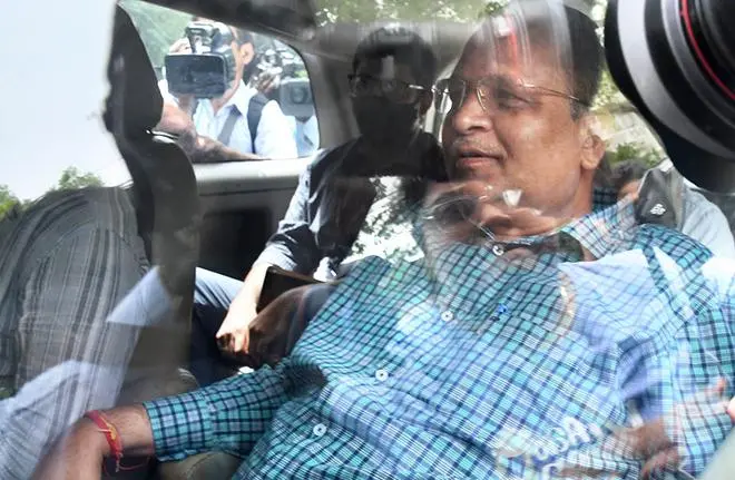 Delhi Health Minister Satyendra Jain, arrested in connection with a money laundering case, being taken to the Rouse Avenue Court, in New Delhi on May 31. He continues to be a Minister despite booked on corruption charges. Delhi Health Minister Satyendra Jain, arrested in connection with a money laundering case, being taken to the Rouse Avenue Court, in New Delhi on May 31. He continues to be a Minister despite booked on corruption charges.
