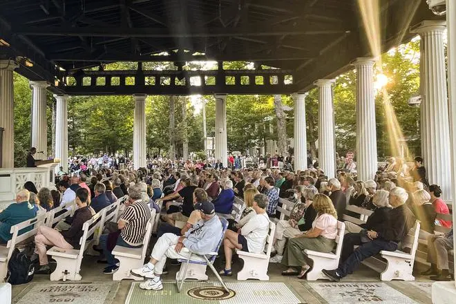 People gather at an evening vigil for author Salman Rushdie after was attacked, in Chautauqua, New York, on August 12. People gather at an evening vigil for author Salman Rushdie after was attacked, in Chautauqua, New York, on August 12.