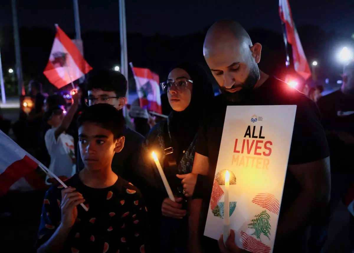 Arab Americans hold a vigil at the Islamic Center of America for the victims of attacks in Lebanon, in Dearborn, Michigan, US, on September 20.