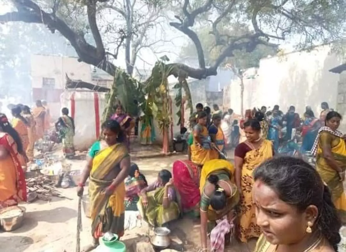 Caste Hindu women prepare sweet rice to offer to new deities at Thenmudiyanur village. 