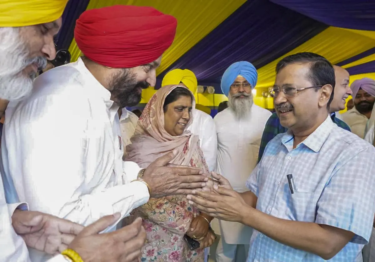 AAP convenor Arvind Kejriwal (right) interacts with Punjab party leaders during a meeting, in New Delhi, on May 5.