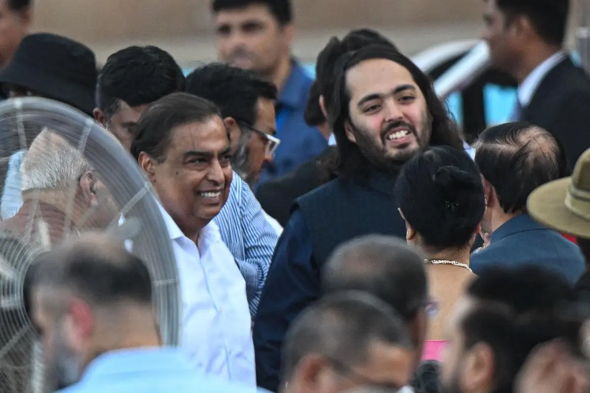 Mukesh Ambani, chairman of Reliance Industries, and his son Anant Ambani at the swearing-in ceremony of Prime Minister Narendra Modi on June 9. Government policy is likely to continue to favour big business in the new regime.