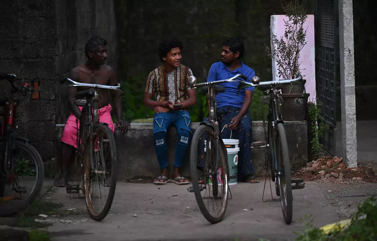 Large numbers of youth migrate for jobs from the North, particularly from Uttar Pradesh, Rajasthan, and Bihar, to the southern States of Karnataka, Tamil Nadu, Kerala, and Goa. In this image, migrant workers from Odisha share a light moment in Nettoor, Kerala.