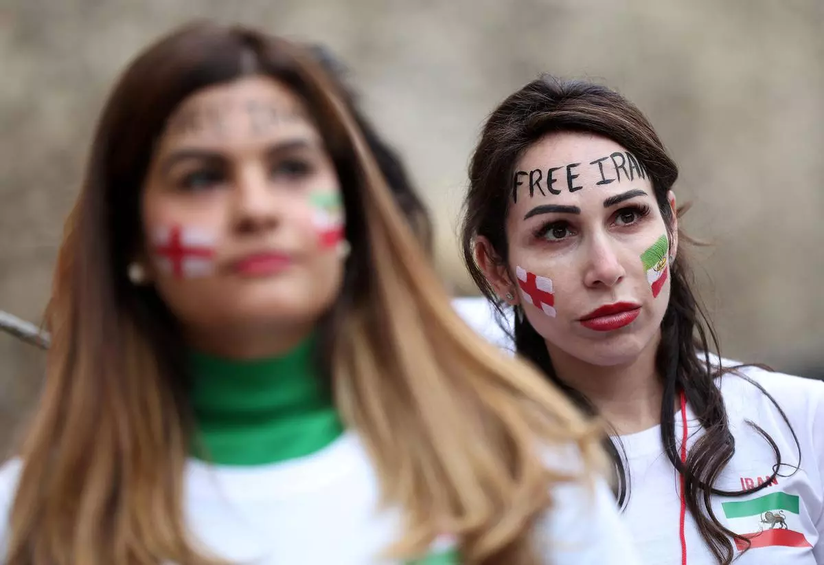 Barred from men's soccer games at home, Iranian women flock to World Cup in  Qatar