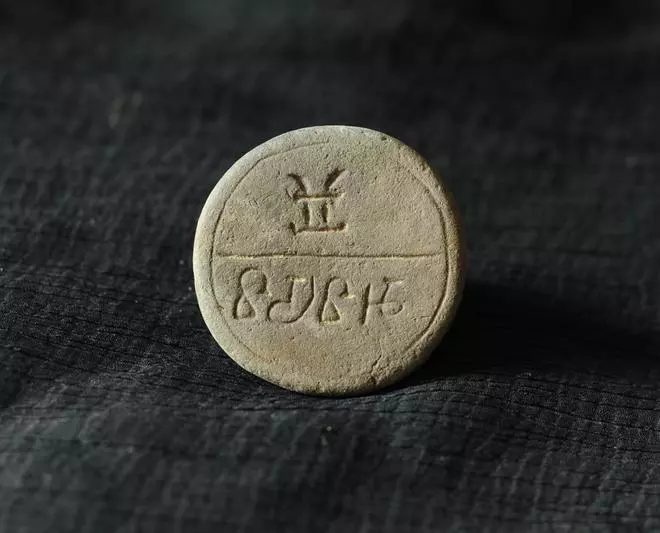 (Above and below) Seals with inscriptions.  Rajat Sanyal, a professor of archaeology at the University of Calcutta: “Some [of the seals] may be associated with a local cult, but mostly they are personal seals of traders who conducted business in that area....” 