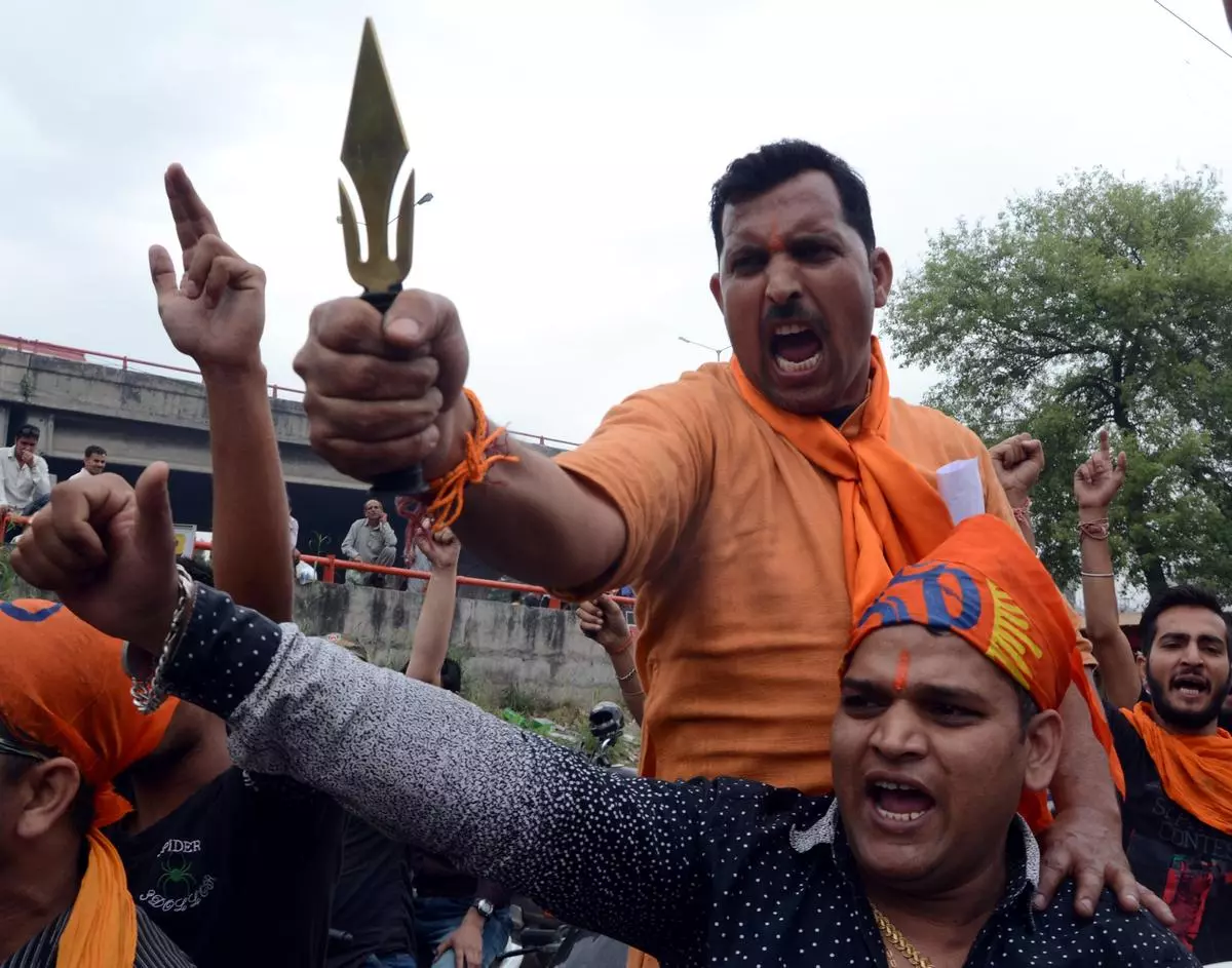 Cultural vigilantism is method of the Vigilantes. It acquires an added life through social media. Bajrang Dal activists brandish knives during a protest demonstration at NIT Srinagar, in 2016.