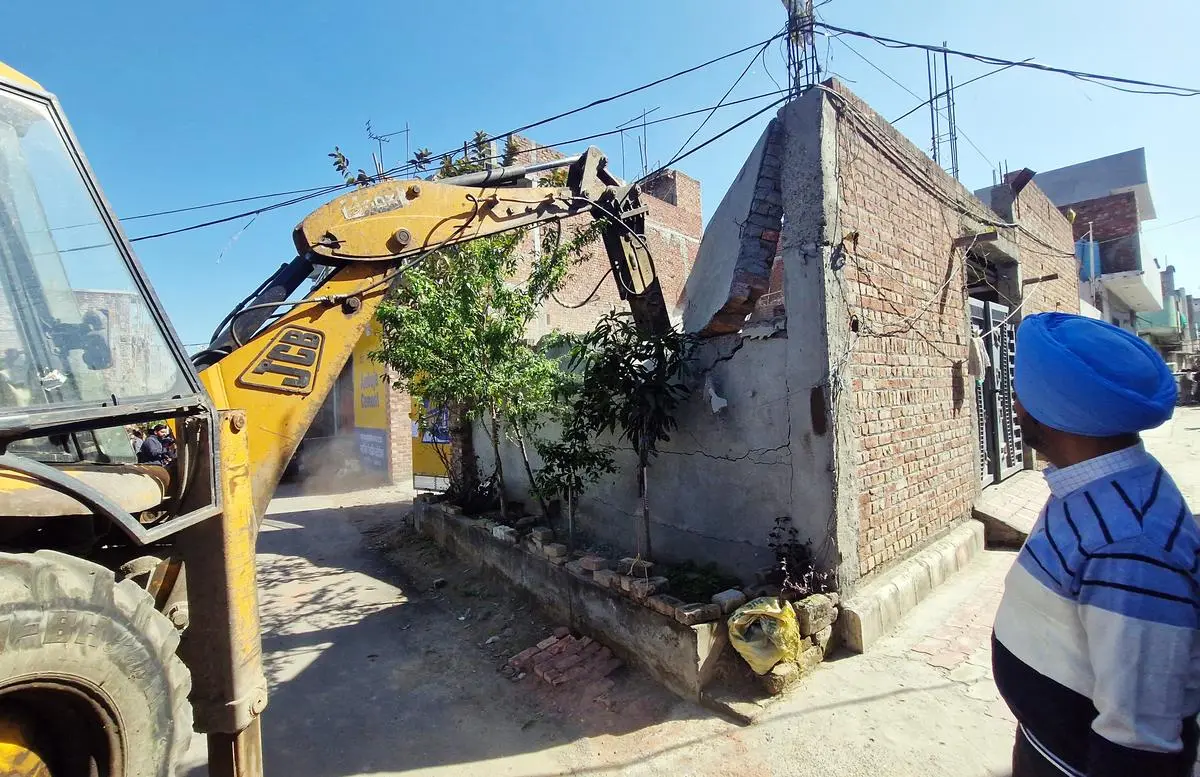 Amritsar Municipal Corporation demolishing a godown belonging to an alleged drug peddler, on March 6. 