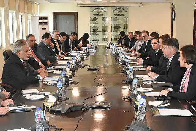 Pakistani Finance Minister Ishaq Dar (left) meeting with an IMF review mission led by Nathan Porter (second right) at the Finance Ministry in Islamabad on January 31. Pakistani Finance Minister Ishaq Dar (left) meeting with an IMF review mission led by Nathan Porter (second right) at the Finance Ministry in Islamabad on January 31.
