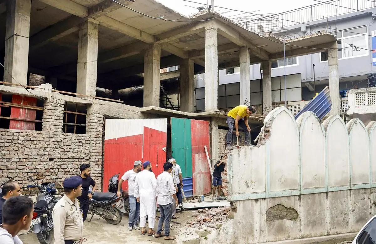 Mosque authorities demolish illegal structures on the order of the Municipal Commissioner, in Mandi on September 13.