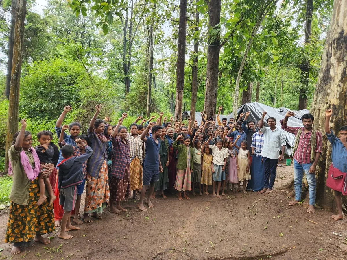 The Jenu Kurubas of Karadi Kallu strike a defiant pose under the leadership of 29-year-old Shivu (in white shirt). Years after eviction and with forest rights applications repeatedly denied, tribal communities are taking back what they consider theirs, raising legal, ecological, and ethical challenges for the state.