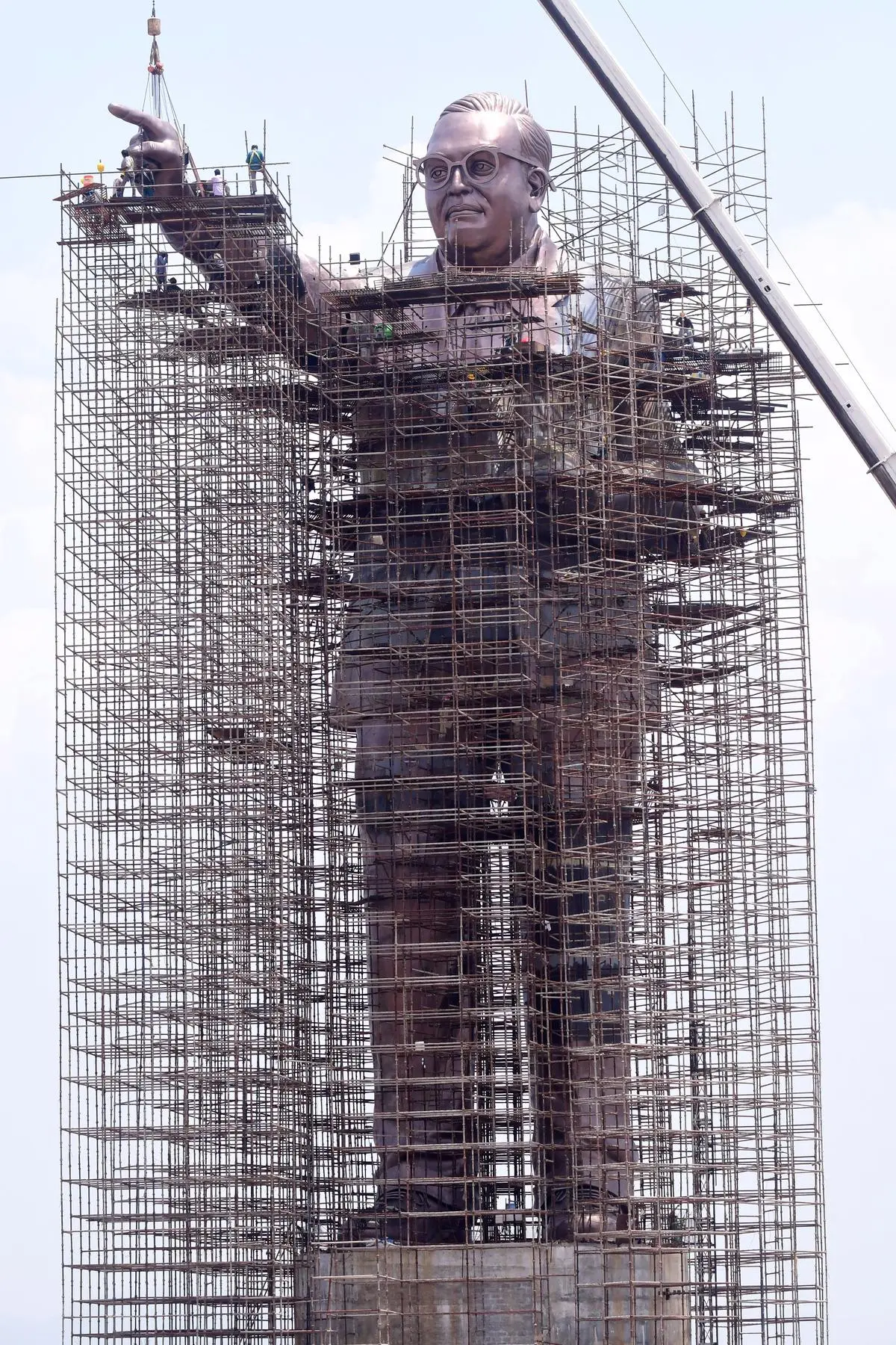 Labourers working on a 125-foot-tall statue of Ambedkar, also known as the Statue of Justice, at Dr. B.R. Ambedkar Smriti Vanam in Vijayawada, in August 2023. 