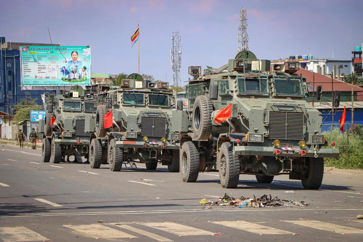 Security forces conduct a flag march along the Imphal Airport Road, to enforce a curfew in Imphal on June 8, 2025. Security forces conduct a flag march along the Imphal Airport Road, to enforce a curfew in Imphal on June 8, 2025.