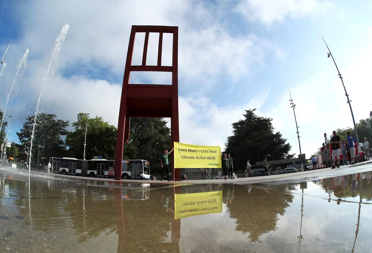 Greenpeace activists hold a banner in front of the United Nations before a IPCC news conference in Geneva, Switzerland, in 2019.
