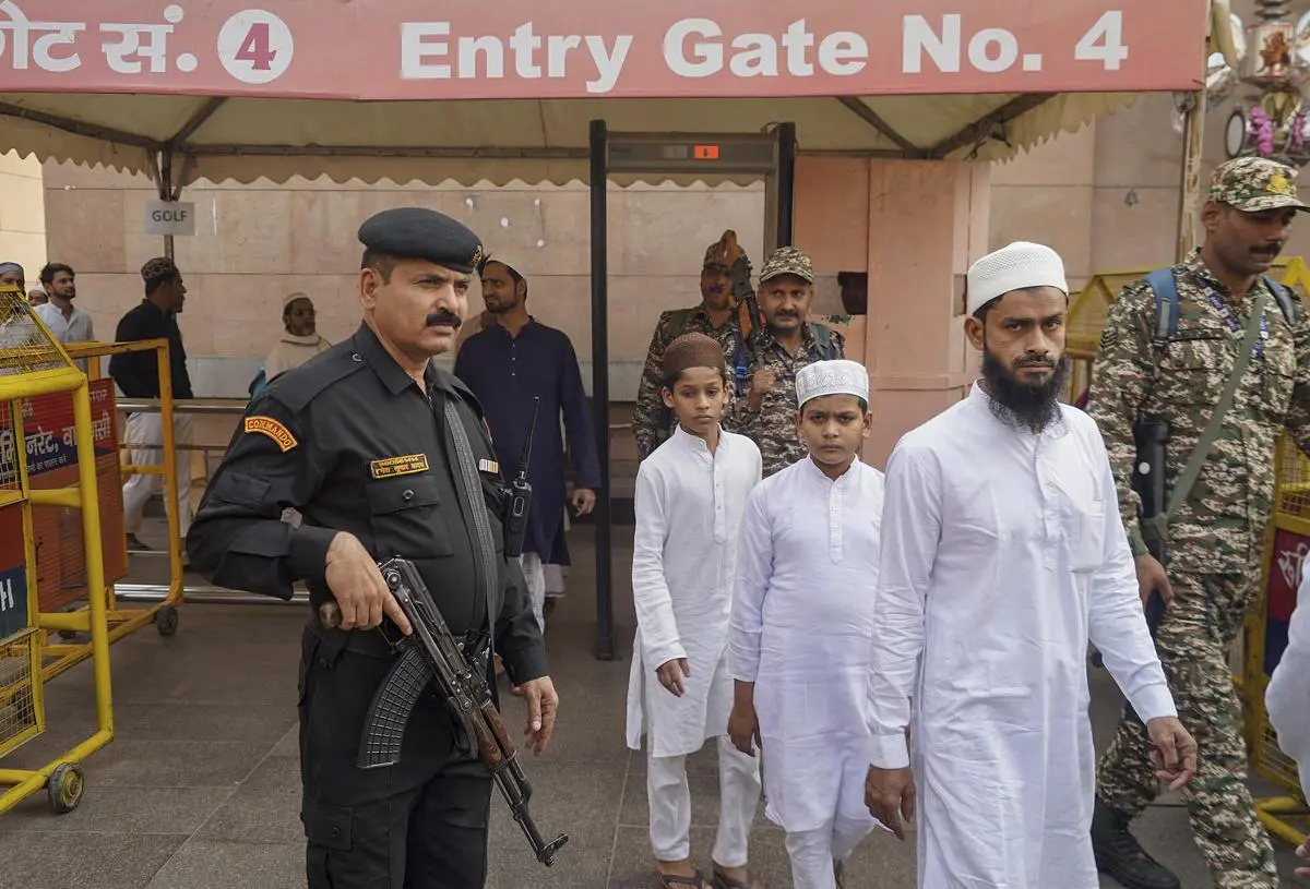 Security personnel keep vigil as Muslims leave after Friday prayers, at Gyanvapi Mosque in Varanasi on November 21.