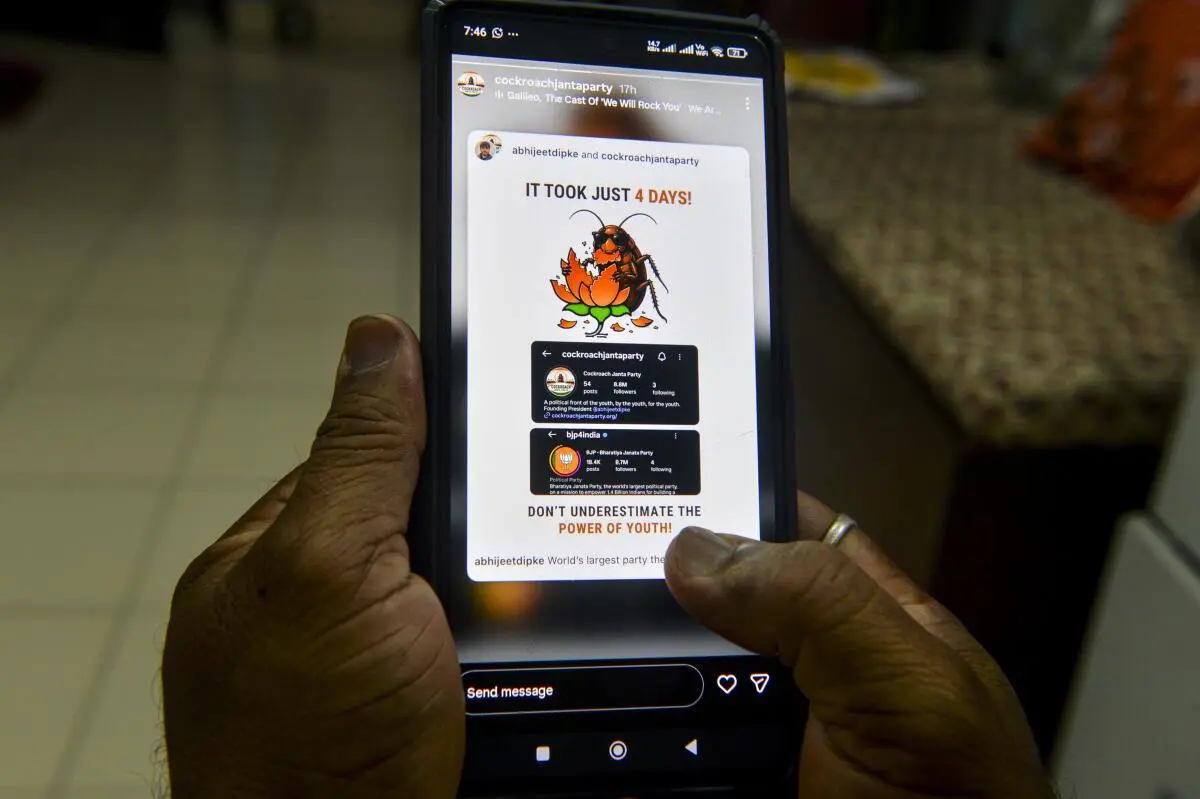 A man browses the Instagram account of the Cockroach Janta Party on social media, in Siligur on May 21, 2026. What began as a satirical response to a Supreme Court remark rapidly evolved into an online phenomenon, attracting millions of supporters and sparking a wider conversation on youth issues, digital mobilisation, and political engagement.
