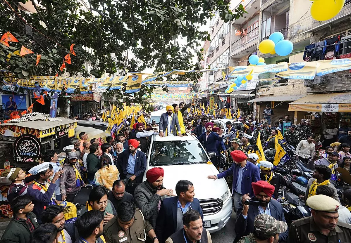 Punjab Chief Minister Bhagwant Mann takes part in a roadshow in support of Atishi, the AAP candidate in the Kalkaji Assembly constituency, in New Delhi on January 30.