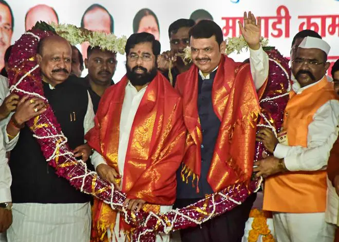 Eknath Shinde, Devendra Fadnavis and Maharashtra Labour Minister Suresh Khade (left) being garlanded at a programme in Navi Mumbai on September 25, 2022. Eknath Shinde, Devendra Fadnavis and Maharashtra Labour Minister Suresh Khade (left) being garlanded at a programme in Navi Mumbai on September 25, 2022.