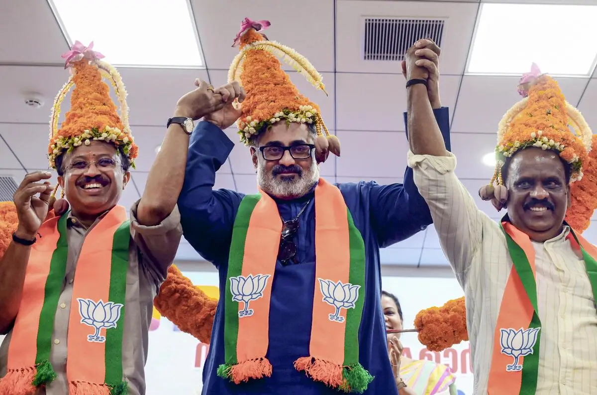 BJP candidates V. Muraleedharan, Rajeev Chandrasekhar, and B.B. Gopakumar
celebrate at the party headquarters in Thiruvananthapuram, on May 5.