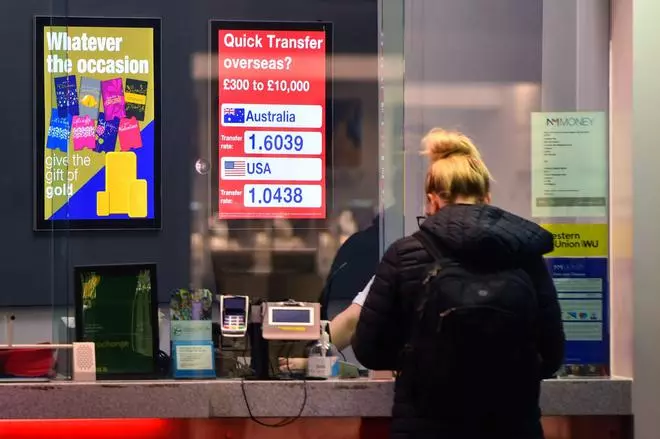 A customer at a currency exchange bureau in the city centre of Liverpool, UK, on September 27. The UK’s stock and bond markets have lost at least $500 billion in combined value in September.
