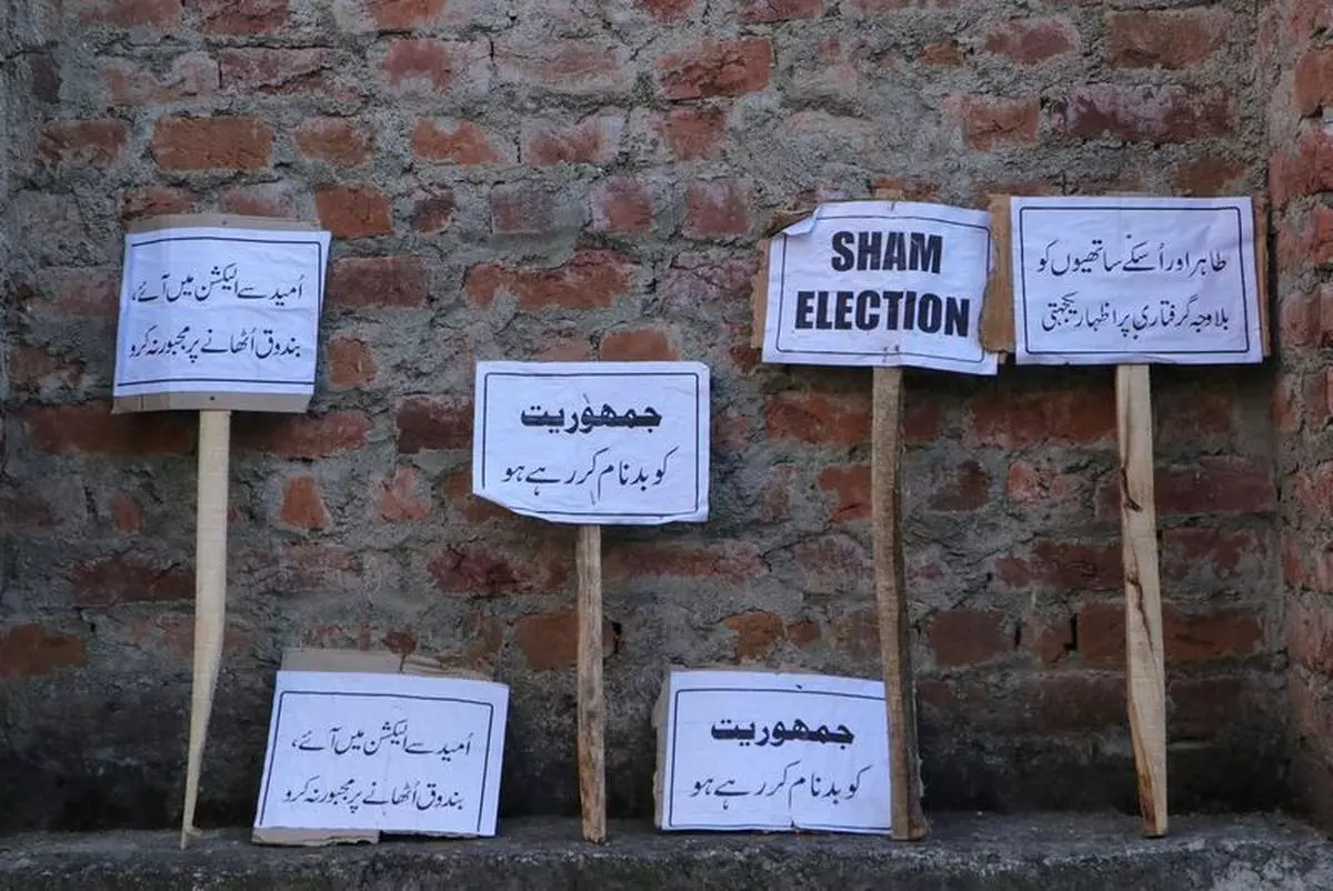 Placards reading “Sham Election” at the Congress headquarters after supporters protested the arrest of the party members. 