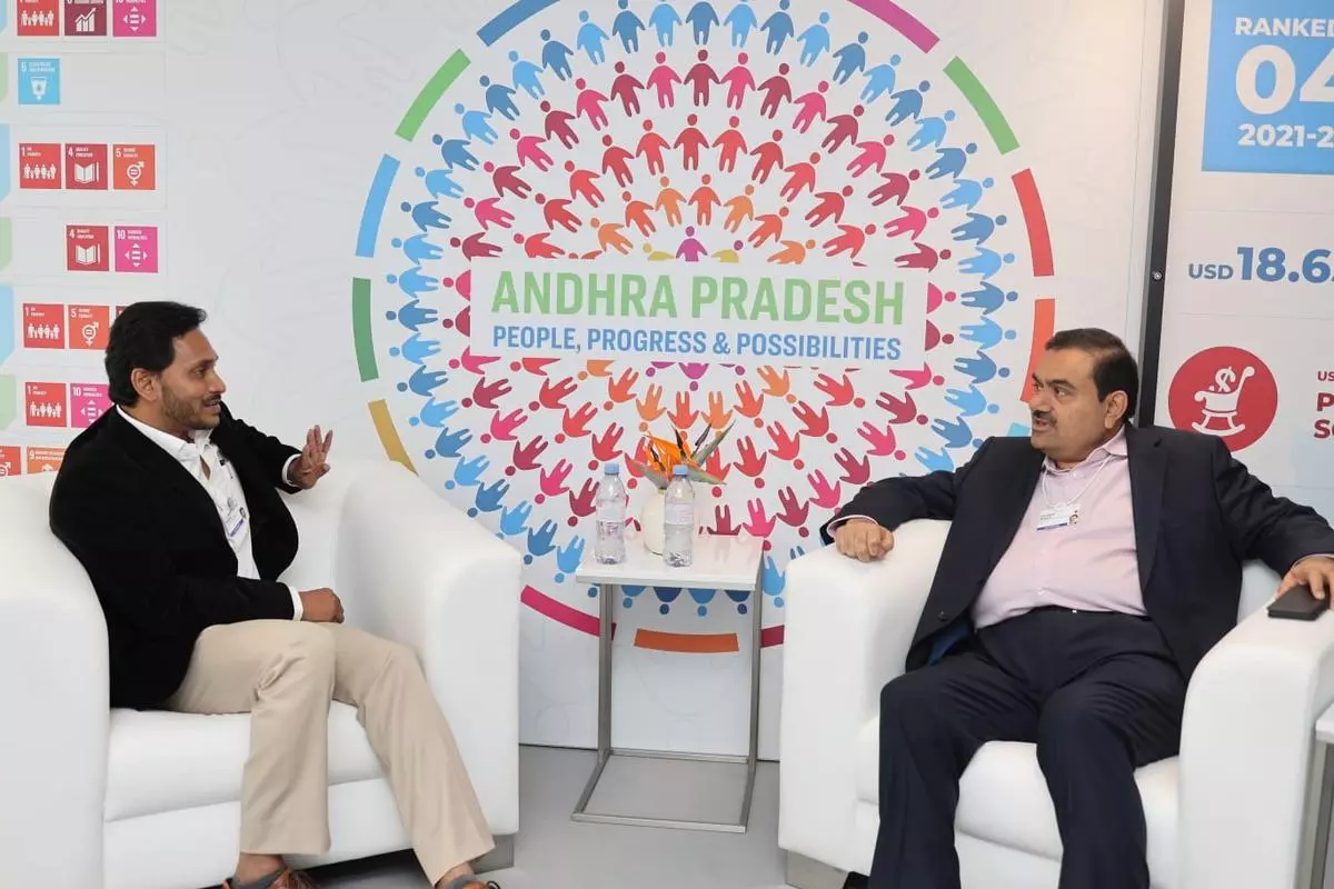 Andhra Pradesh Chief Minister Y.S. Jagan Mohan Reddy interacting with Adani Group chairman Gautam Adani at the World Economic Forum at Davos in Switzerland on May 22, 2022. 