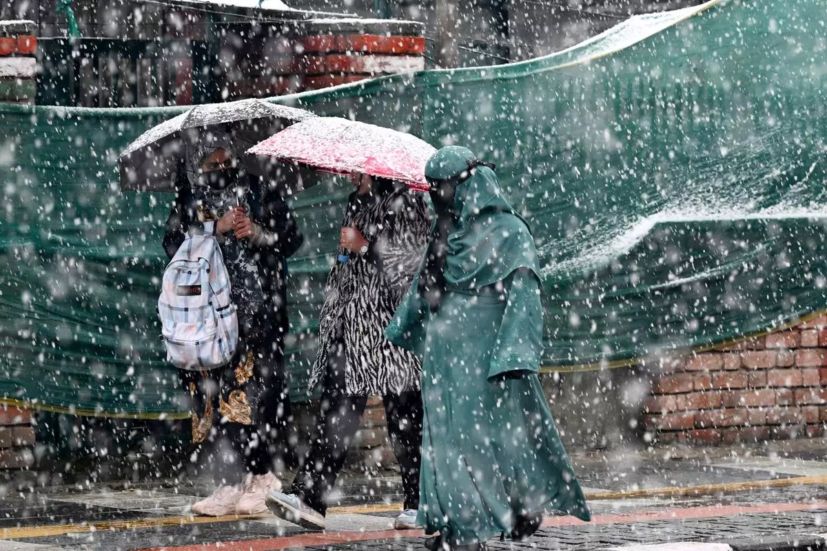 Much has been written about India’s climate woes and the loss of lives, properties, livelihoods and the GDP. And by extension, on the need for adaptation and mitigation. Here, women carry umbrellas amid snowfall in Srinagar this February