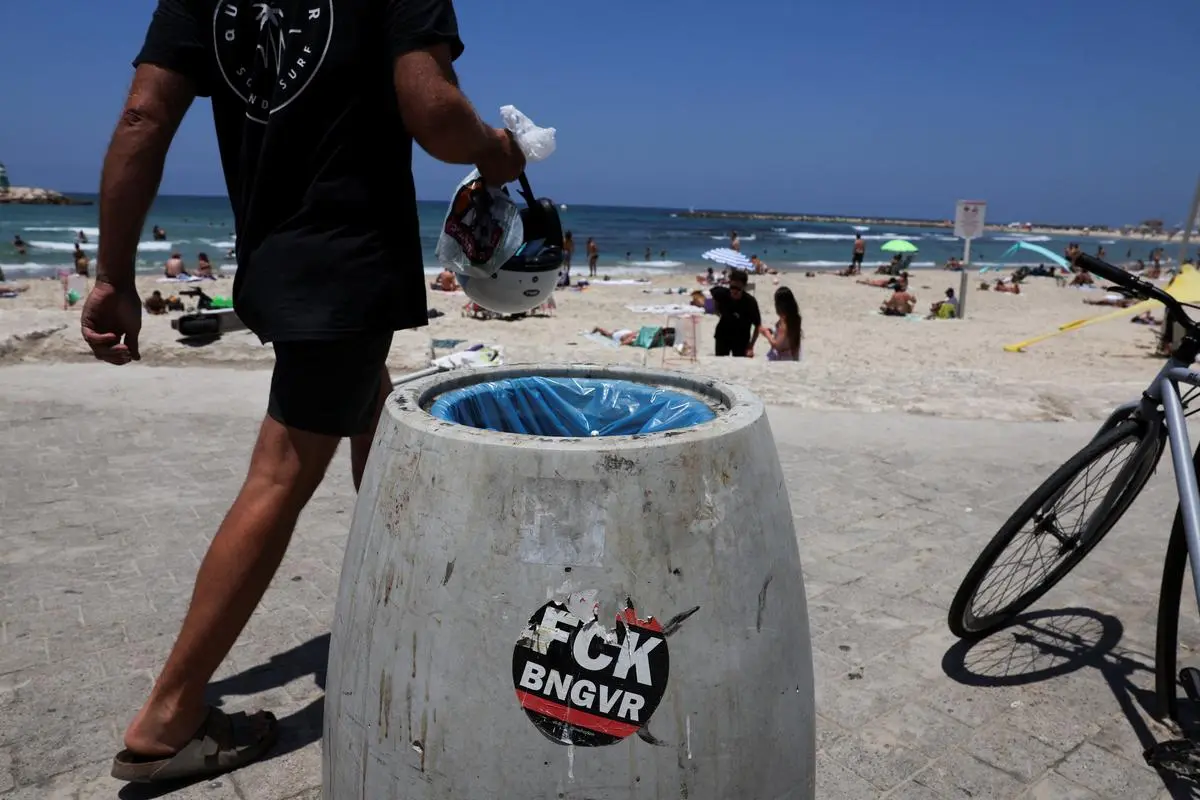 A trash bin sticker directed at Israeli National Security Minister Itamar Ben-Gvir at a beach in Tel Aviv on June 21. Ben-Gvir left the Netanyahu government when it accepted the three-phase ceasefire in January, only to rejoin after Israel resumed the Gaza offensive. 