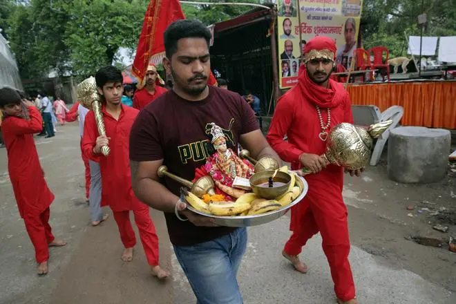 Outside the temple, devotees on their way to perform rituals. Outside the temple, devotees on their way to perform rituals.