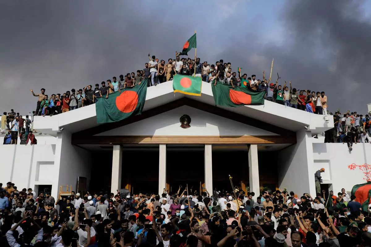 Anti-government protestors storm the then-Prime Minister Sheikh Hasina’s palace in Dhaka on August 5, 2024. Students turned their success of driving out Hasina into the main plank to gain political prominence and popularity.