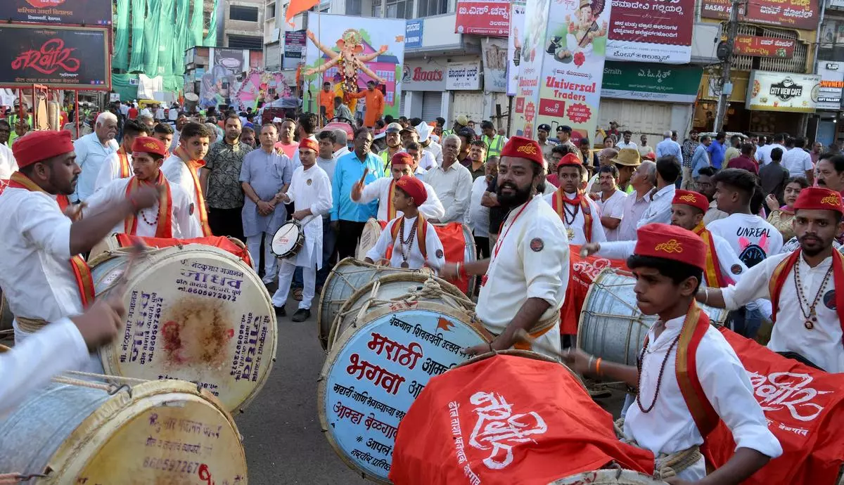 Young people playing drums along the route of the Ganesha idol immersion procession in Belagavi, Karnataka, in September. 