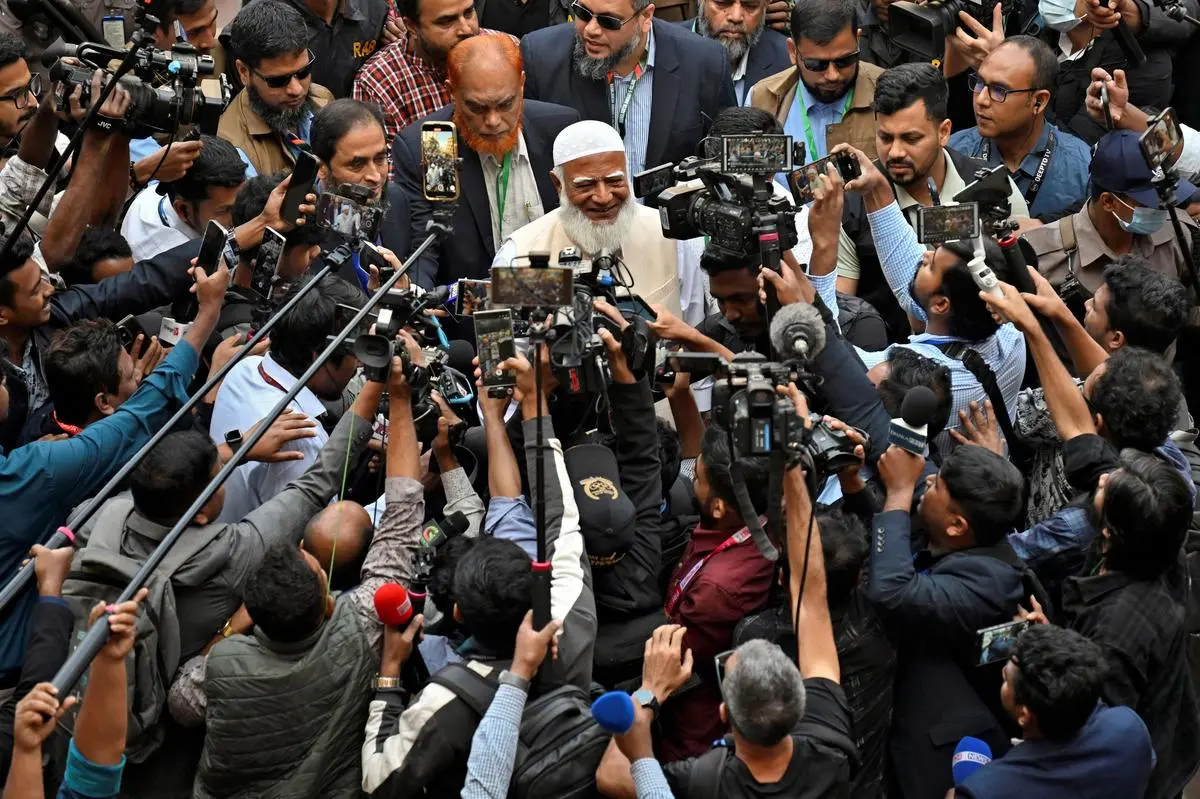 Shafiqur  Rahman, Ameer (president), Jamaat-e-Islami, speaks with the media after voting, outside a polling station during the national election in Dhaka on February 12. 