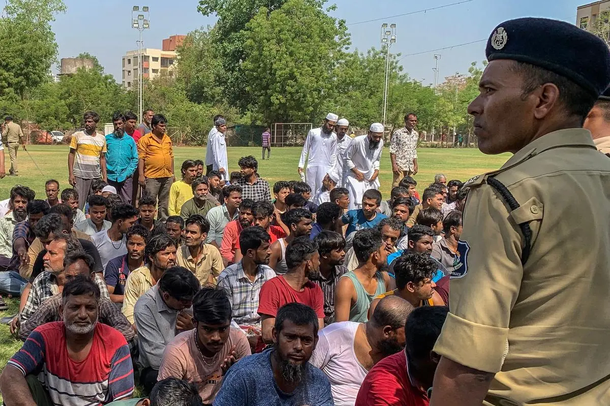 Detained Bangladeshi migrants at a crime branch office following an overnight operation by the police in Ahmedabad on April 26, 2025. Over 1,000 “migrants” were rounded up in a sweeping crackdown in Gujarat aimed at identifying and deporting illegal residents, the State government said on April 26. 