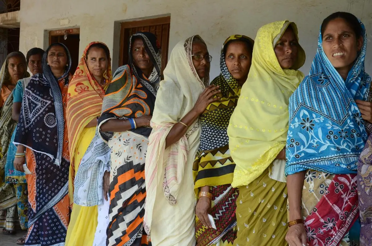 As women voters come out in ever larger numbers to vote, political parties have woken up to the electoral dividends of cash-transfer schemes targeted at women. Here, a file photograph of voters in West Bengal’s Pingla constituency in Paschim Medinipur district. 