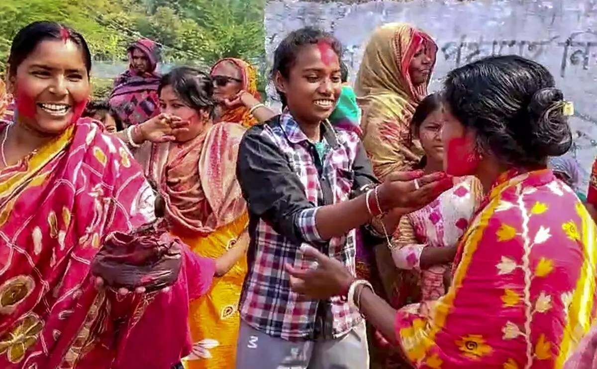 Villagers celebrate following the arrest of Sheikh Shahjahan on February 29. 