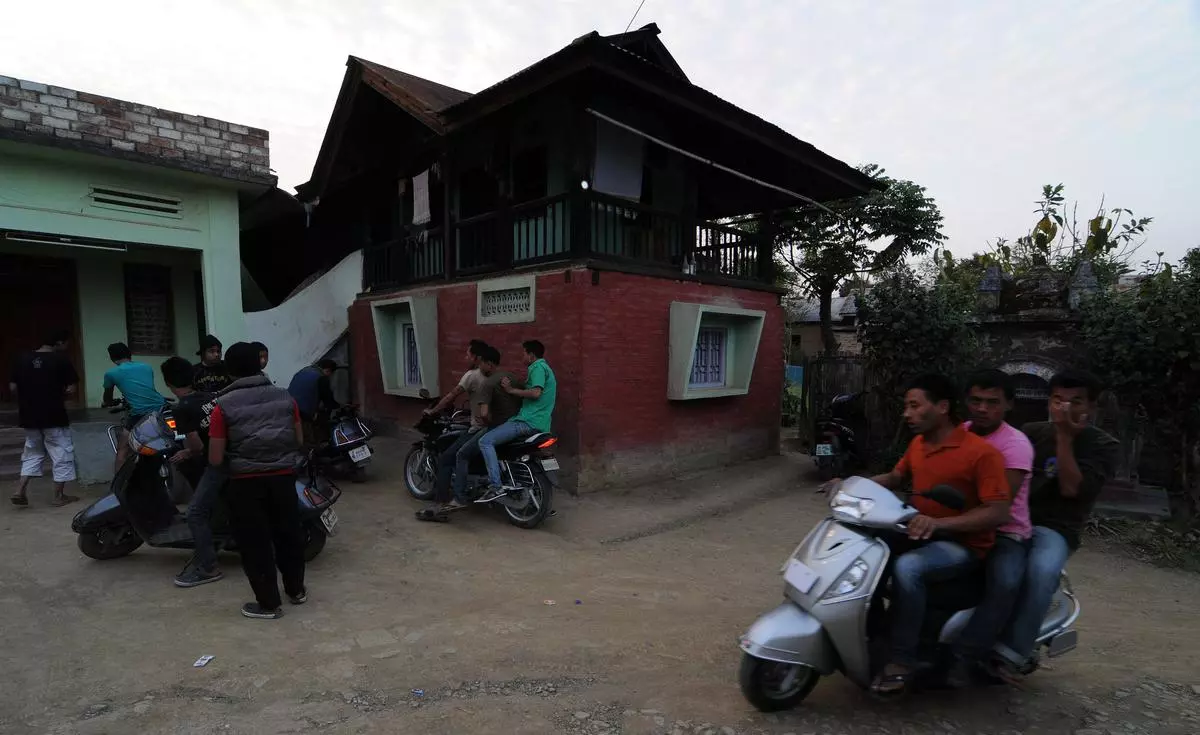 Customers flock to one of the several illegal liquor shacks in Manipur in 2014.