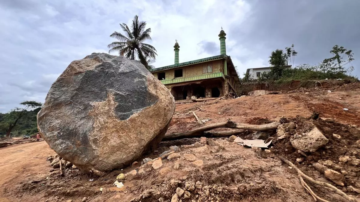 The mosque in the background was spared to an extent but not much around it. The giant rock, yet to be cleared away by rehabilitation teams, stands silent testimony to nature’s fury.