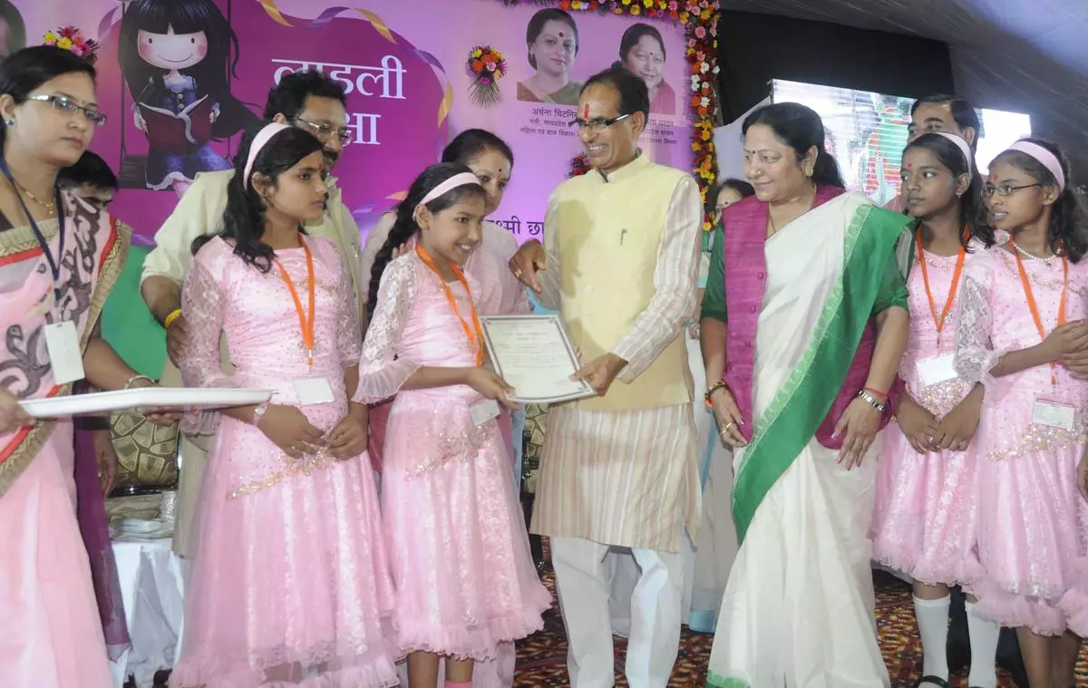 Madhya Pradesh Chief Minister Shivraj Singh Chouhan giving away scholarships to girl students in Bhopal as part of the Ladli Laxmi scheme. Women-centric schemes such as this helped the BJP win a thumping victory in 2023.