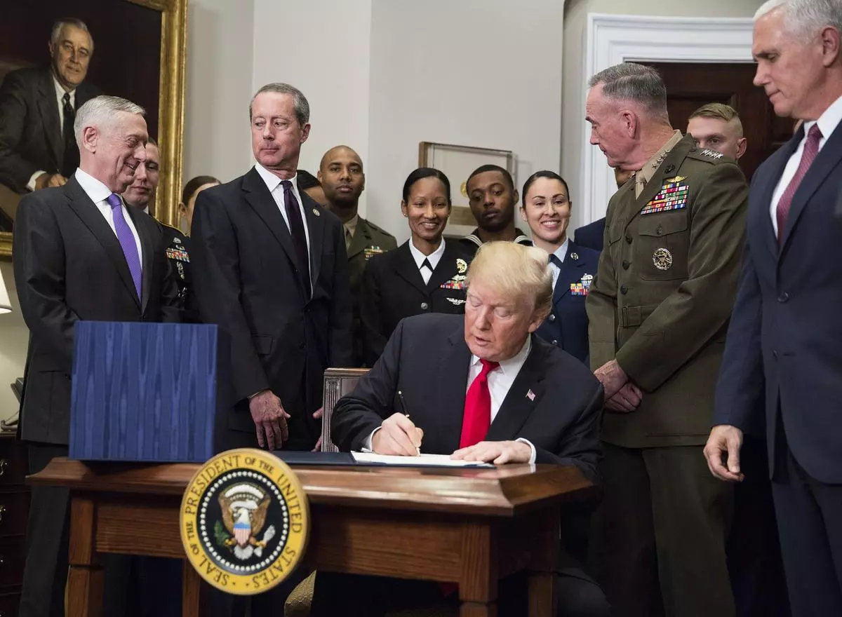 Donald Trump signs the National Defense Authorization Act (NDAA) for 2018, in Washington on December 12, 2017. The Act authorises the US defence budget, which has ballooned from over $600 billion then to nearly $900 billion in 2024.