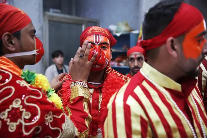 A make-up session of the Bajrangi Sena before it sets out to the various temples in the area. A make-up session of the Bajrangi Sena before it sets out to the various temples in the area.