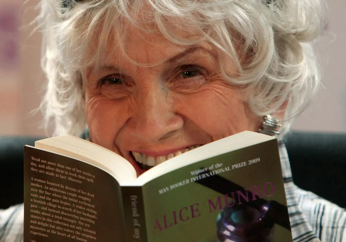 Munro holds one of her books as she receives her Man Booker International award at Trinity College Dublin in 2009. Munro holds one of her books as she receives her Man Booker International award at Trinity College Dublin in 2009.